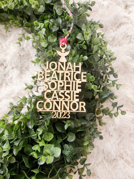 Family Name Christmas tree ornament - A perfect addition to your Christmas tree this holiday season. Personalized with your names, this ornament is made in the shape of a Christmas tree with choice of a topper (snowflake or star)