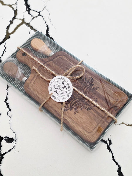 small floral engraved cheese board for hostess gift . Comes wrapped in a gift box