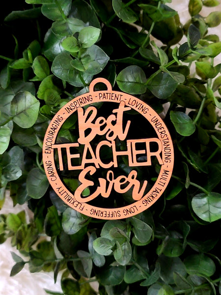 Best Teacher Ever Ornament. Made of wood and laser engraved. Teacher appreciation words are engraved on the Christmas ornament - inspiring, caring, loving, understanding