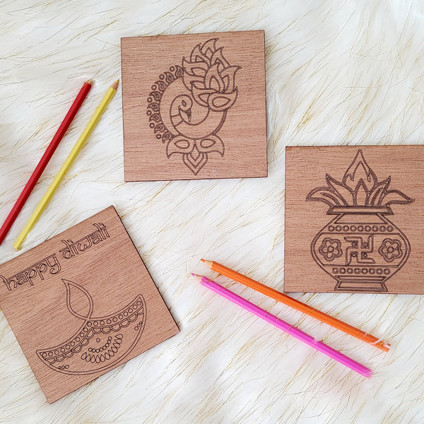 Diwali coloring kit made of wood. Engraved with the words Happy Diwali, Peacock Rangoli, Kalash and Diya - Earthern Lamp. Home decor for Indian South Asian home during the hindu festival of Diwali or Deepavali - Festival of Lights. Can also be used as decorative pieces or favors for kids.