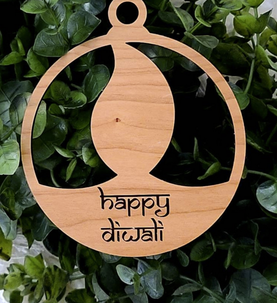 Diwali Diya or Lamp ornament made of wood. Engraved with the words Happy Diwali. Home decor for Indian South Asian home during the hindu festival of Diwali or Deepavali - Festival of Lights. Can also be used as a gift tag. Personalization options available.